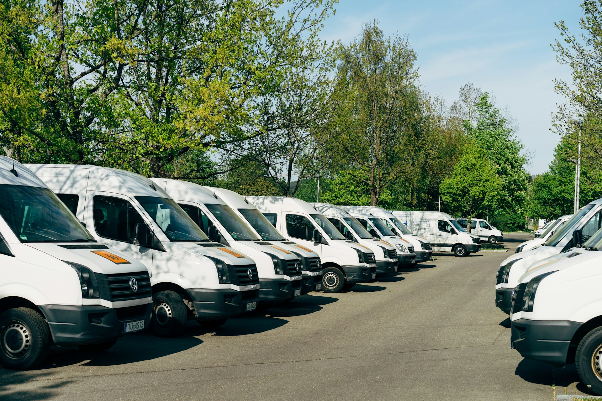Two rows of delivery trucks ready to ship packages