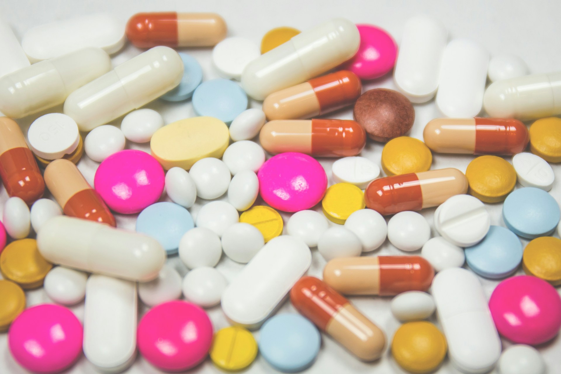 An assortment of different brightly colored supplement pills