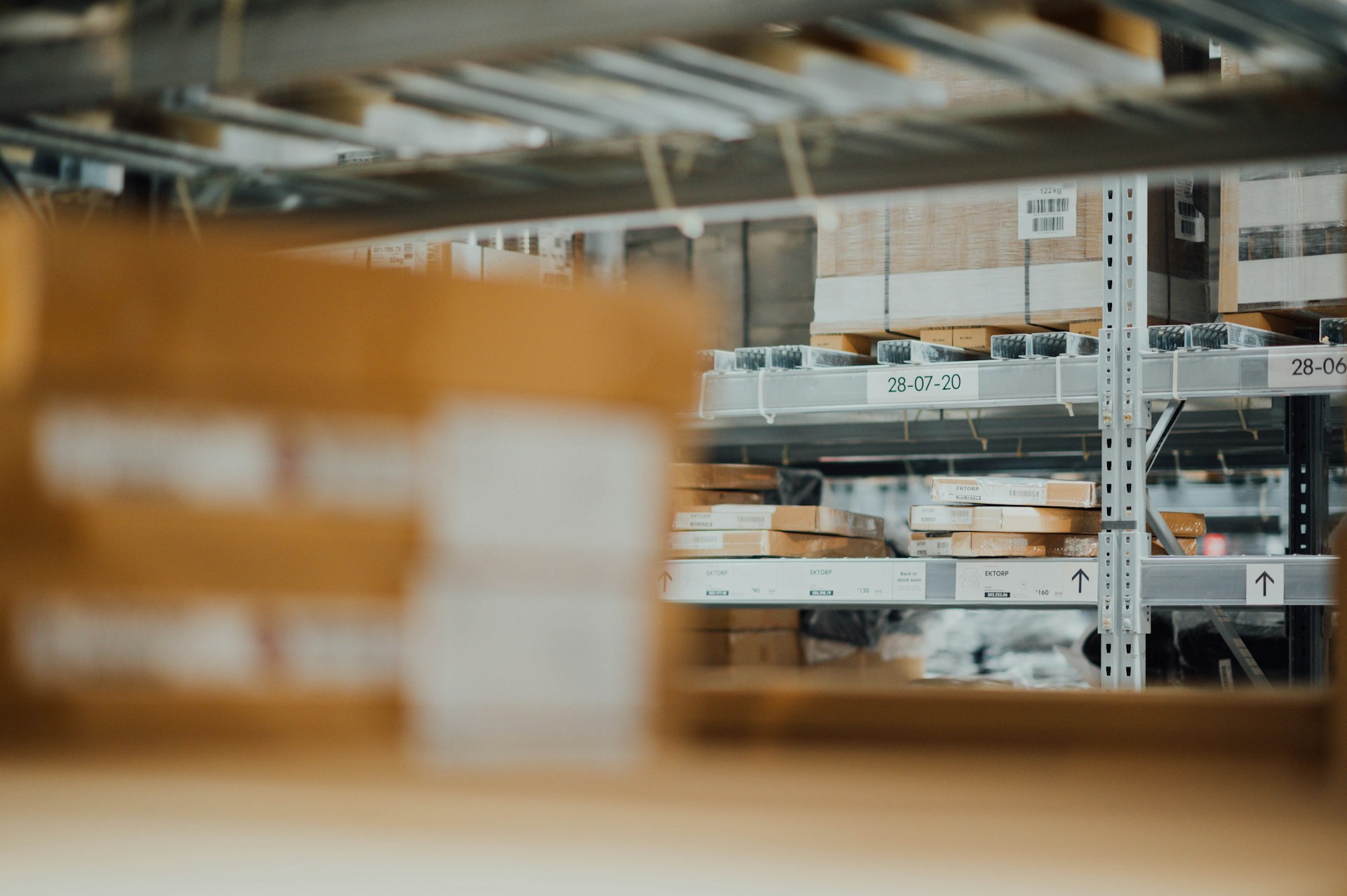 Racks in a warehouse with items on them ready for merchant fulfillment